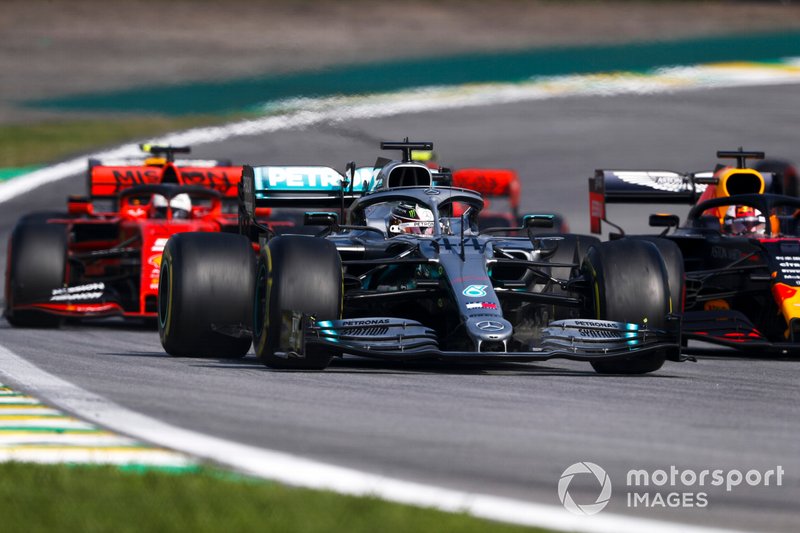 Lewis Hamilton, Mercedes AMG F1 W10 leads Max Verstappen, Red Bull Racing RB15 and Sebastian Vettel, Ferrari SF90 at the restart