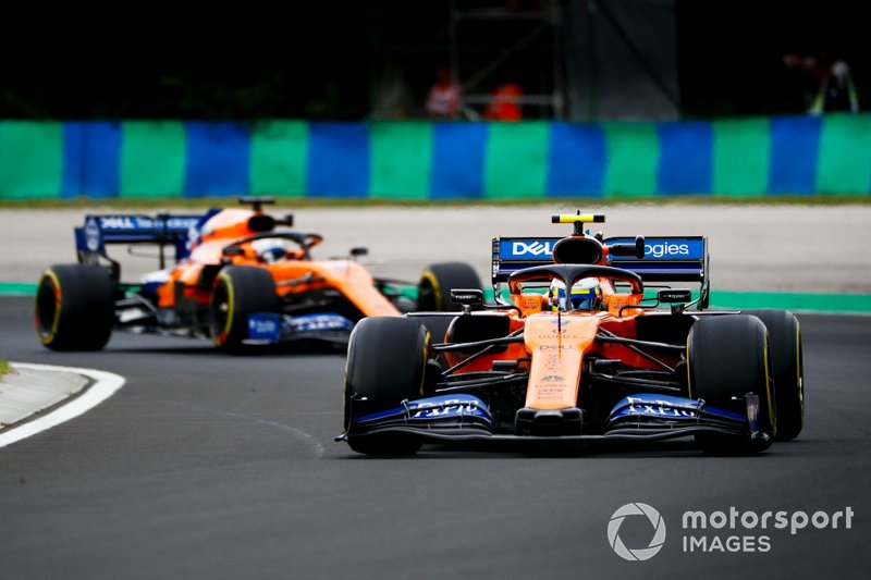 Lando Norris, McLaren MCL34, leads Carlos Sainz Jr., McLaren MCL34