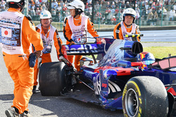 Marshals recover the car of race retiree Carlos Sainz Jr., Scuderia Toro Rosso STR12