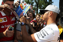 Lewis Hamilton, Mercedes AMG F1 signs autographs for the fans