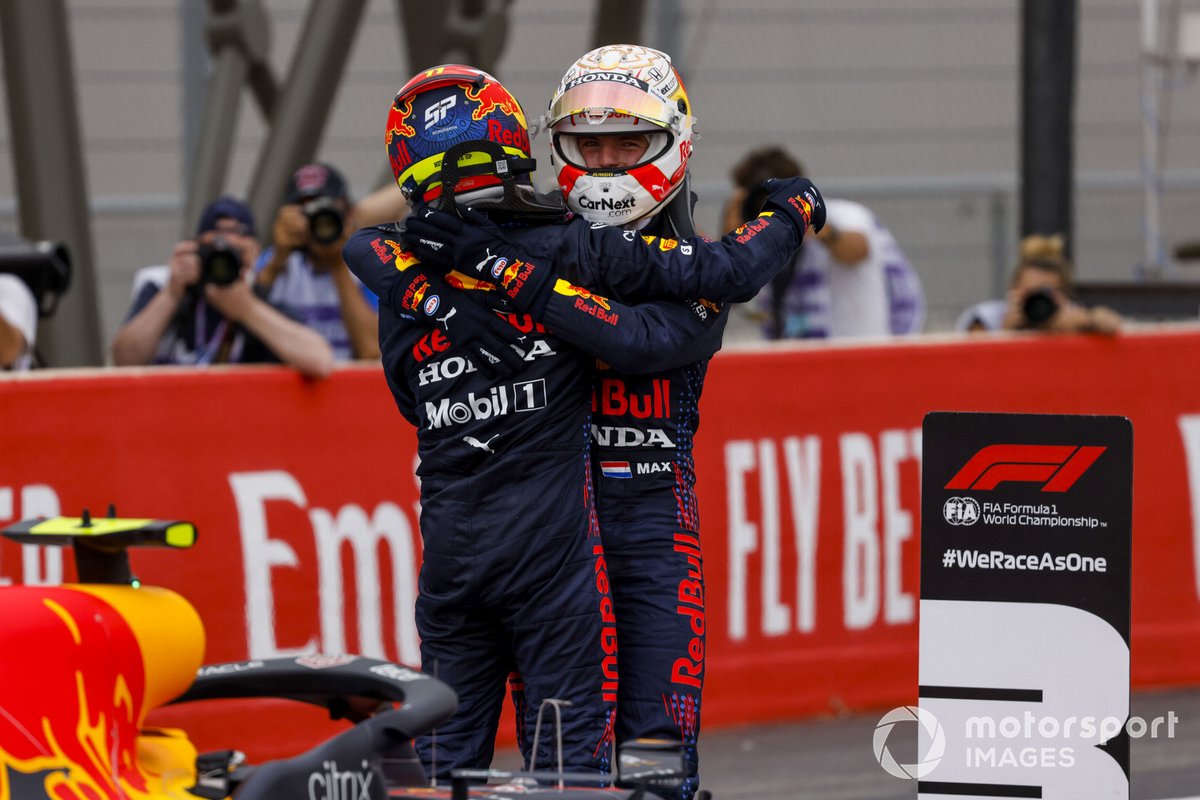 Sergio Perez, Red Bull Racing, 3rd position, and Max Verstappen, Red Bull Racing, 1st position, celebrate in Parc Ferme