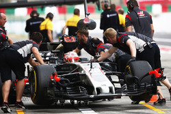 Kevin Magnussen, Haas F1 Team VF-17, is returned to the garage