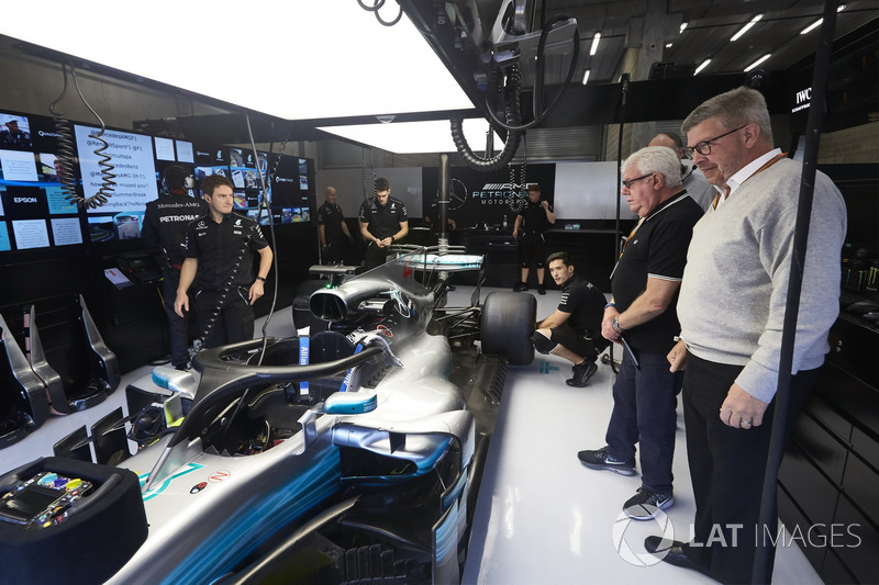 Ross Brawn, Managing Director of Motorsports, FOM, visits the Mercedes garage for a look at the Halo device fitted to the car of Lewis Hamilton, Mercedes AMG F1 W08