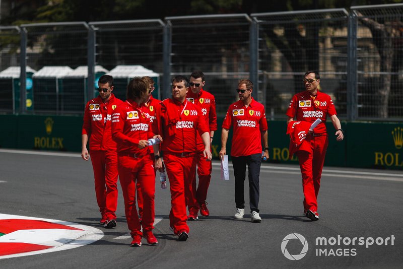 Sebastian Vettel, Ferrari walks the track with his engineers