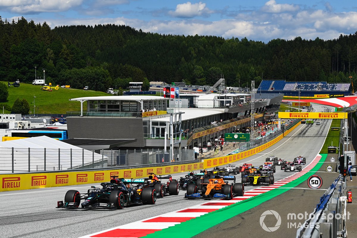 Lewis Hamilton, Mercedes F1 W11 EQ Performance, leads Max Verstappen, Red Bull Racing RB16, Carlos Sainz Jr., McLaren MCL35 Valtteri Bottas, Mercedes F1 W11 EQ Performance and the rest of the pack at the start