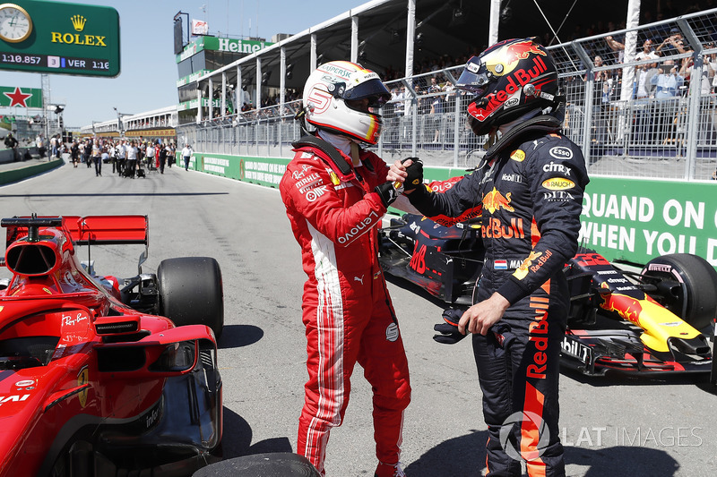 Il poleman Sebastian Vettel, Ferrari e Max Verstappen, Red Bull Racing festeggiano nel parco chiuso