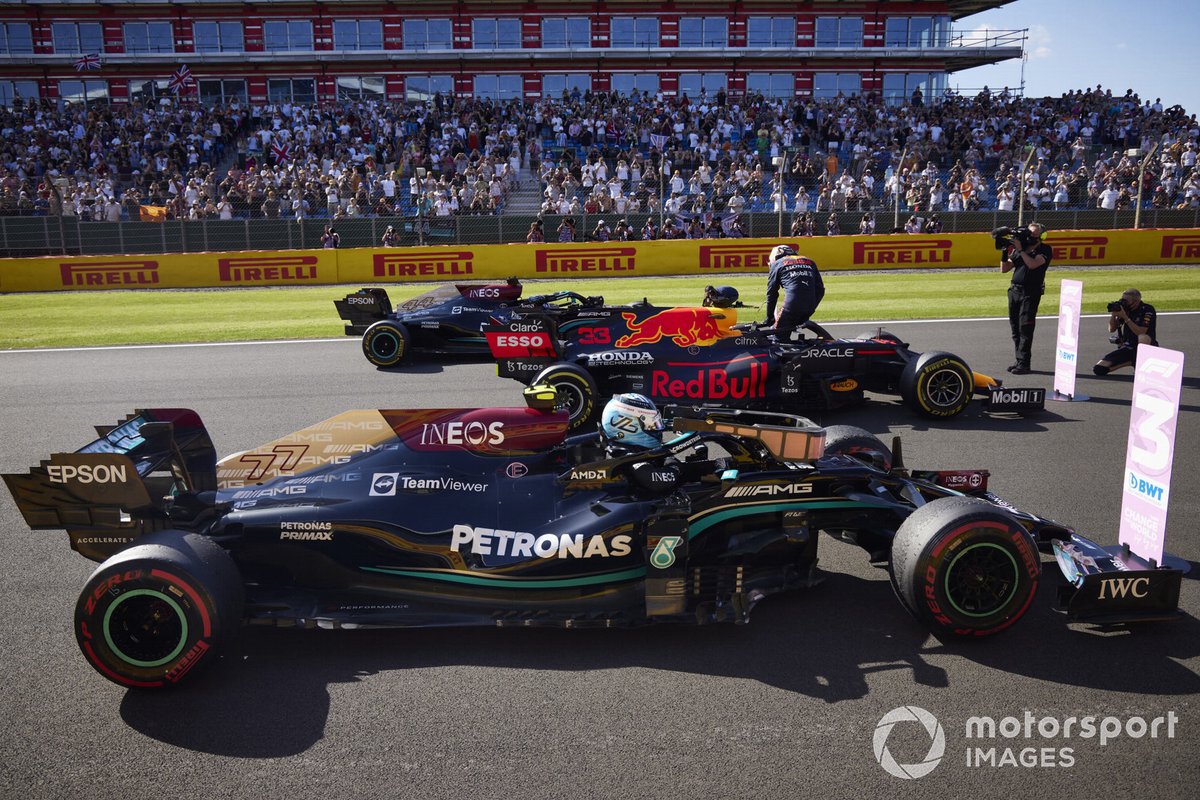 Valtteri Bottas, Mercedes W12, 3rd position, Max Verstappen, Red Bull Racing RB16B, 1st position, and Lewis Hamilton, Mercedes W12, 2nd position