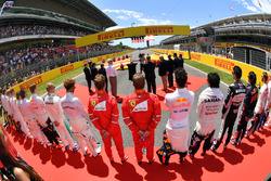 Drivers observe the national anthem