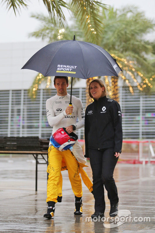 Jolyon Palmer, Renault Sport F1 Team in a wet and rainy paddock with Aurelie Donzelot, Renault Sport F1 Team Media Communications Manager
