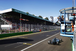 Lewis Hamilton, Mercedes AMG F1 W08, takes the chequered flag to win the race