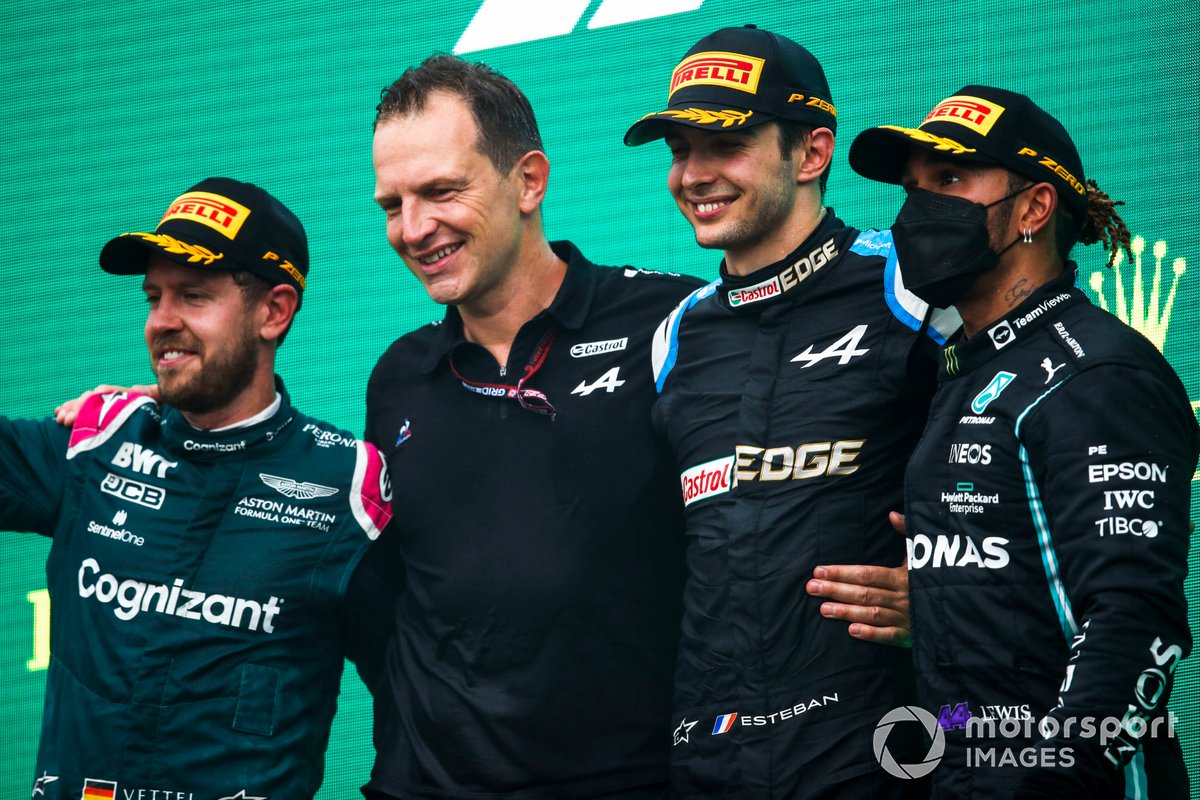 Sebastian Vettel, Aston Martin, 2nd position, Laurent Rossi, CEO, Alpine F1, Esteban Ocon, Alpine F1, 1st position, and Lewis Hamilton, Mercedes, 3rd position, on the podium
