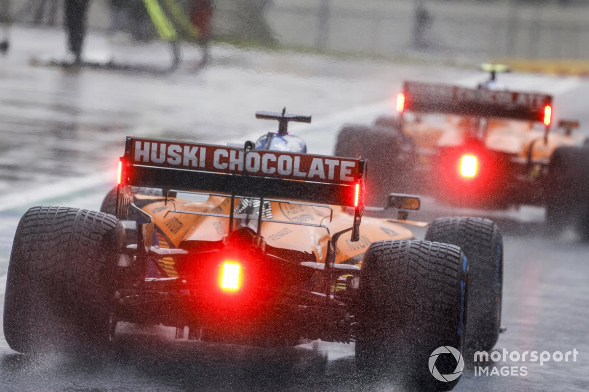 Lando Norris, McLaren MCL35, Carlos Sainz Jr., McLaren MCL35 out of the pit lane