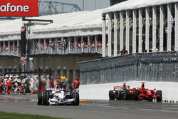 Robert Kubica, BMW Sauber F1.08 passes Lewis Hamilton, McLaren Mercedes MP4/23 and the Kimi Raikkonen, Ferrari F2008