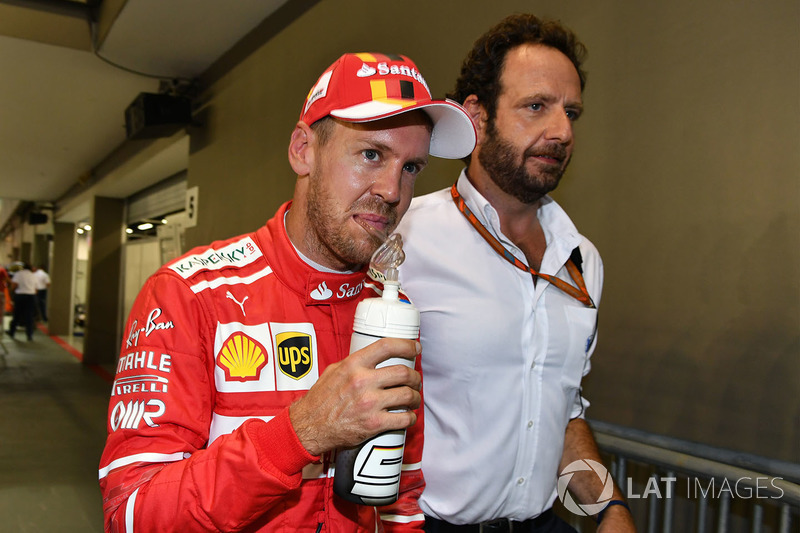 Sebastian Vettel, Ferrari and Matteo Bonciani, FIA Media Delegate