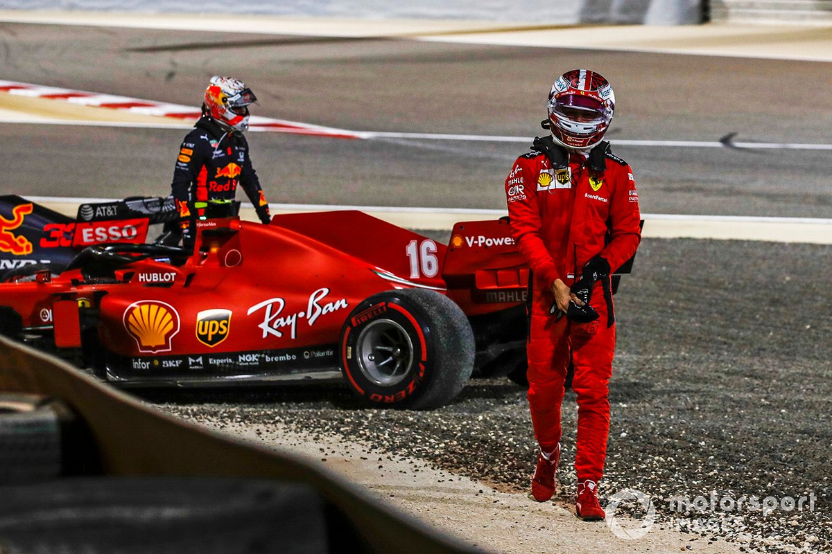 Max Verstappen, Red Bull Racing, and Charles Leclerc, Ferrari, walk away after retiring