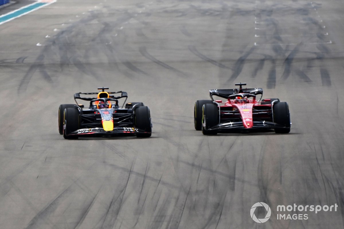 Max Verstappen, Red Bull Racing, passes Charles Leclerc, Ferrari