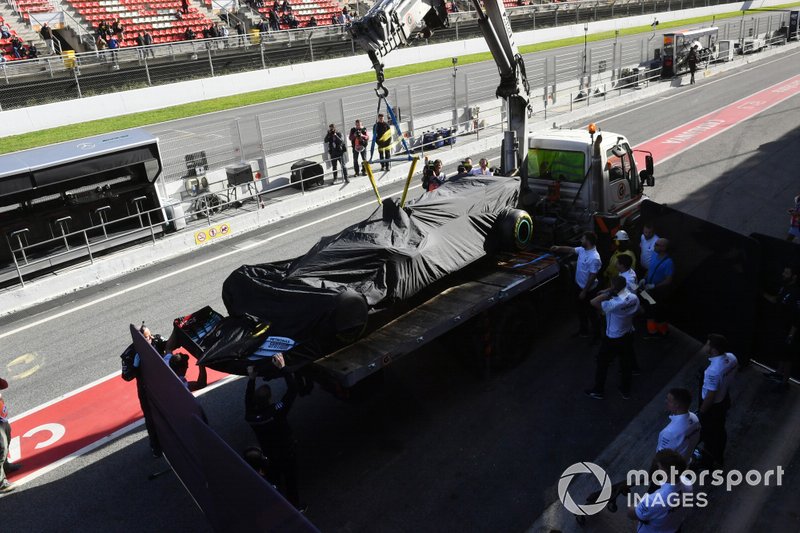 Lewis Hamilton's Mercedes F1 W11 is returned to the pits