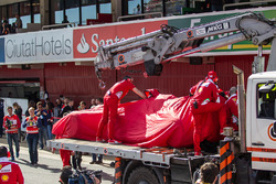 The Ferrari SF16-H of Kimi Raikkonen, Ferrari is recovered back to the pits on the back of a truck