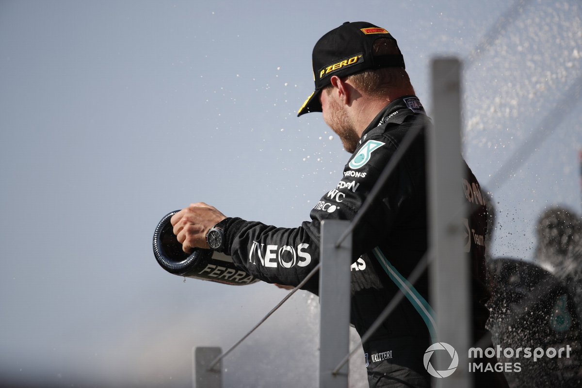 Valtteri Bottas, Mercedes, 3rd position, sprays the Champagne