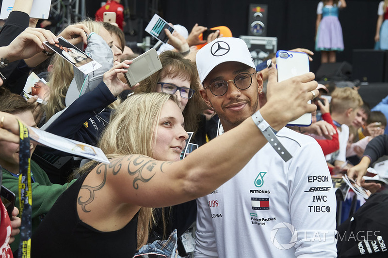 Lewis Hamilton, Mercedes AMG F1, poses for fan to take a picture