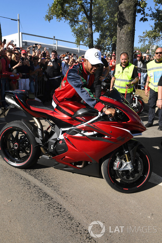 Lewis Hamilton, Mercedes AMG F1 arrives at the track on his motorbike