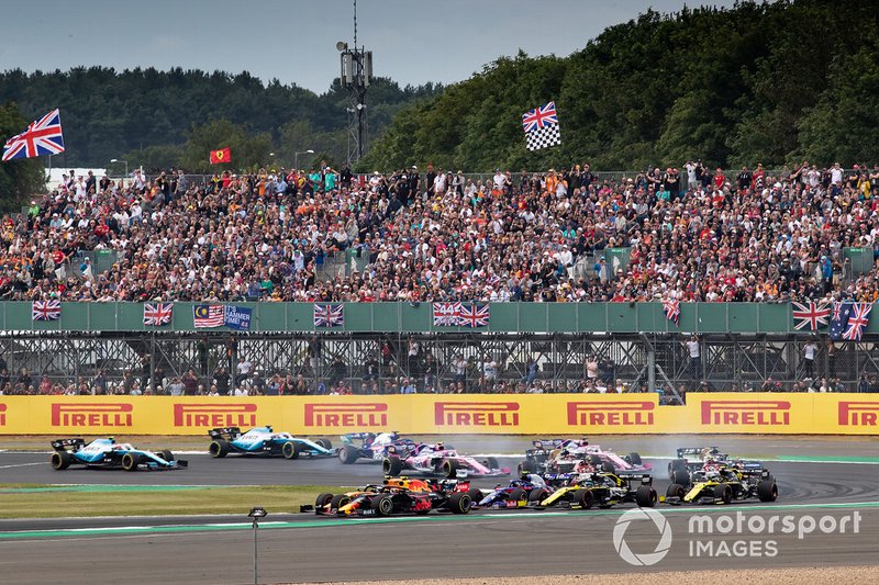Pierre Gasly, Red Bull Racing RB15, battles with Lando Norris, McLaren MCL34, at the start of the race