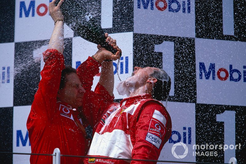 Michael Schumacher, Ferrari celebrates with team boss Jean Todt