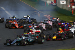 Valtteri Bottas, Mercedes AMG F1 W08, leads Max Verstappen, Red Bull Racing RB13, Kimi Raikkonen, Ferrari SF70H, Felipe Massa, Williams FW40, and the remainder of the field at the start