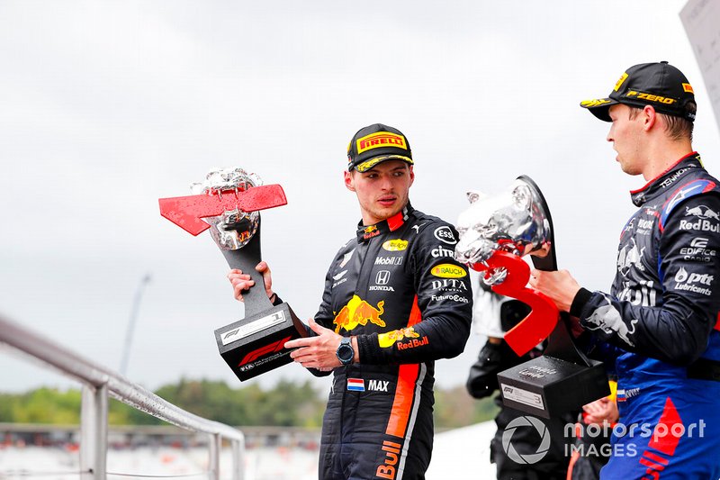 Max Verstappen, Red Bull Racing, 1st position, and Daniil Kvyat, Toro Rosso, 3rd position, on the podium with their trophies