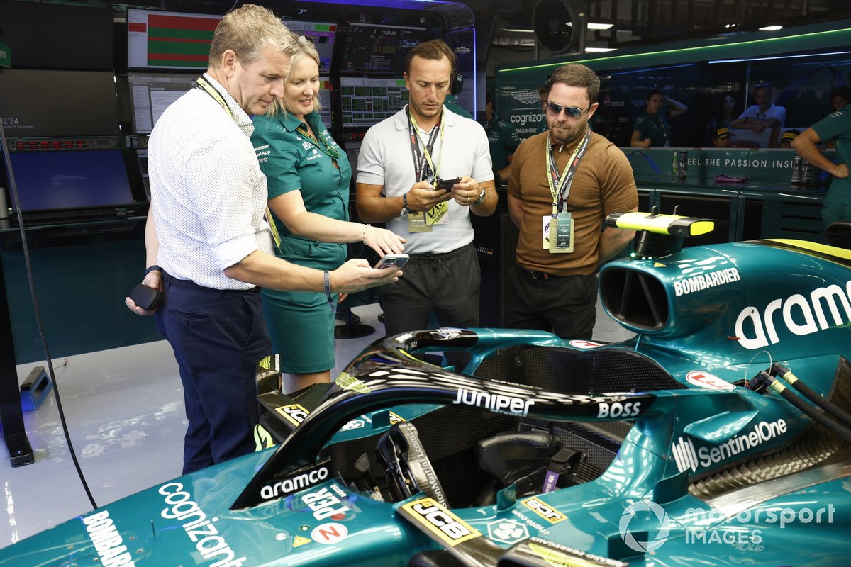 Aston Martin AMR22 garage with guests former West Ham United footballer Mark Noble
