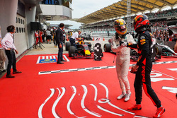 Lewis Hamilton, Mercedes AMG F1 and race winner Max Verstappen, Red Bull Racing celebrate in parc ferme