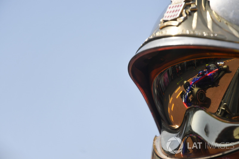 Pierre Gasly, Scuderia Toro Rosso STR13 reflected in a fireman helmet