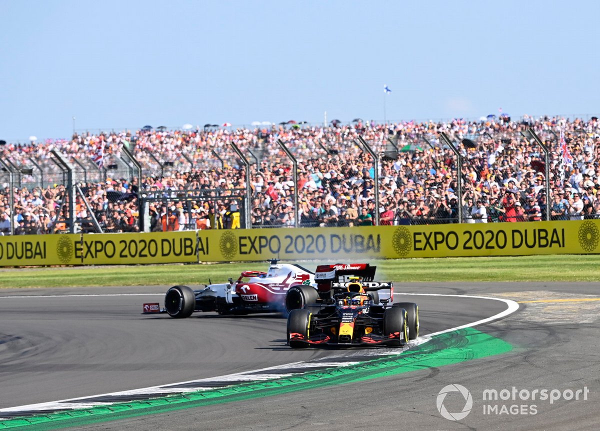 Kimi Raikkonen, Alfa Romeo Racing C41, spins after contact with Sergio Perez, Red Bull Racing RB16B