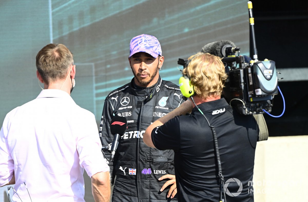 Lewis Hamilton, Mercedes, 1st position, is interviewed by Jenson Button after the race