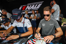 Lance Stroll, Williams and Stoffel Vandoorne, McLaren sign autographs for the fans