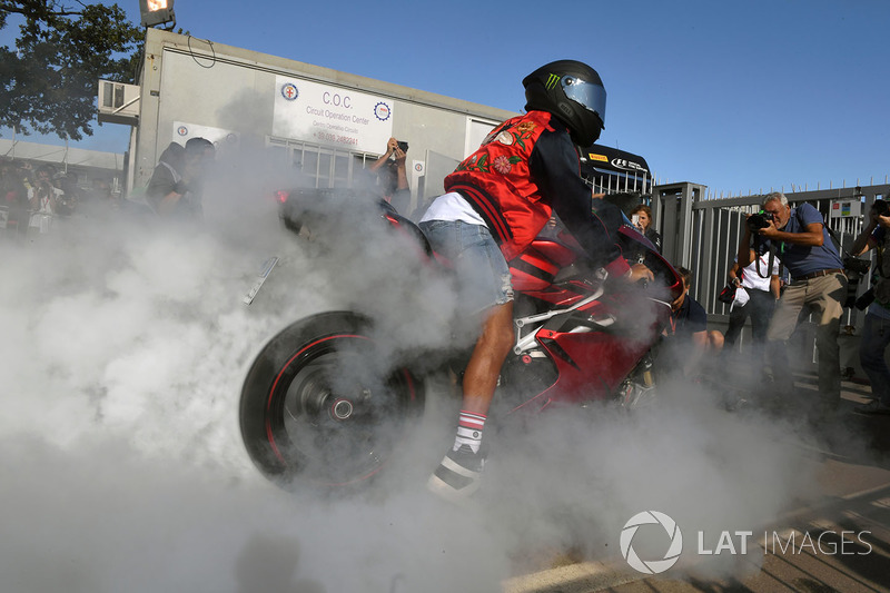 Lewis Hamilton, Mercedes AMG F1 does a burnout on his motorbike