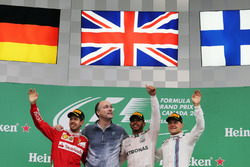 The podium (L to R): Sebastian Vettel, Ferrari, second; Lewis Hamilton, Mercedes AMG F1, race winner