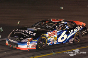 Mark Martin takes a victory lap amidst the dollar bills after winning the No Bull 5 million dollar bonus at Charlotte
