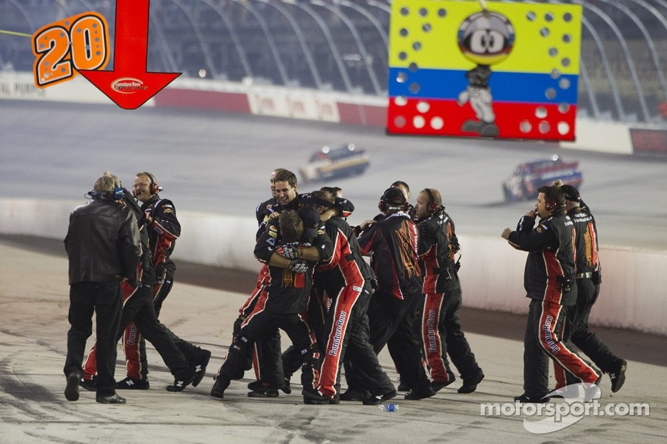 Furniture Row Racing Chevrolet crew members celebrate the victory of Regan Smith