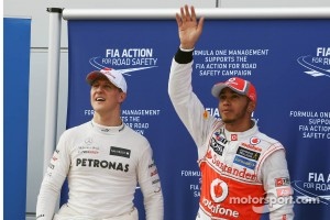 Michael Schumacher, Mercedes GP celebrates his third position in parc ferme with pole sitter Lewis Hamilton, McLaren Mercedes