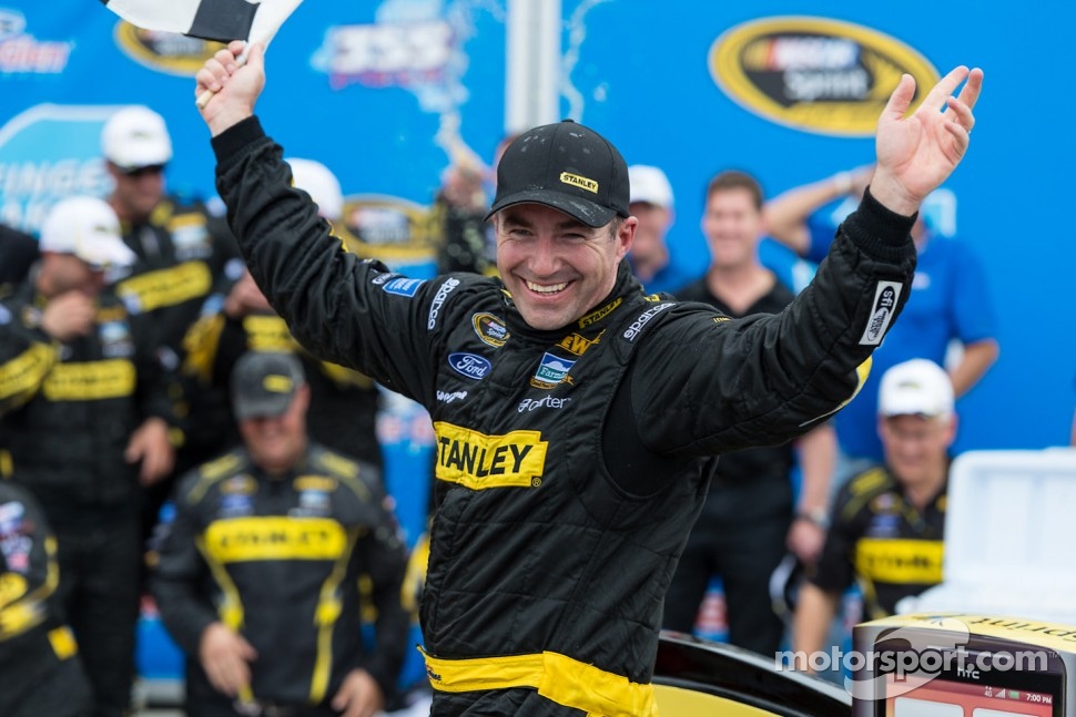 Victory lane: race winner Marcos Ambrose celebrates