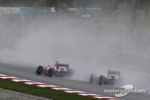 Sergio Perez, McLaren MP4-28 leads Adrian Sutil, Sahara Force India VJM06