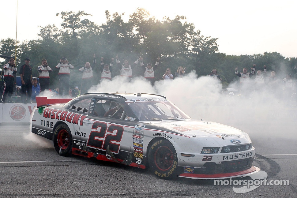 Race winner A.J. Allmendinger celebrates