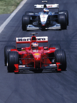 Michael Schumacher, Ferrari and Mika Hakkinen, McLaren