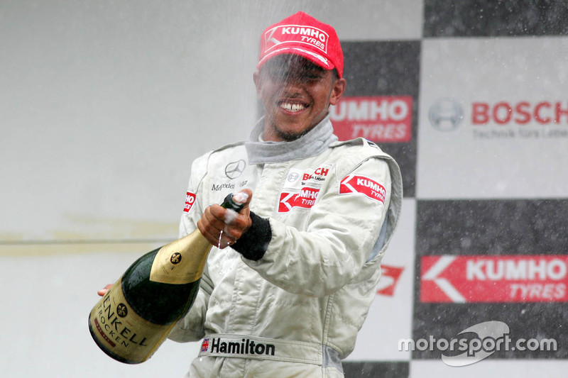 Podium: third place Lewis Hamilton spraying champaign