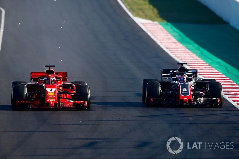 Kimi Raikkonen, Ferrari SF71H, Romain Grosjean, Haas F1 Team VF-18