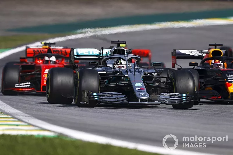 Lewis Hamilton, Mercedes AMG F1 W10 leads Max Verstappen, Red Bull Racing RB15 and Sebastian Vettel, Ferrari SF90 at the restart