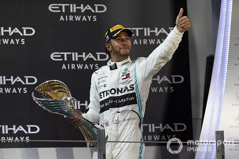Lewis Hamilton, Mercedes AMG F1, 1st position, leaves the podium with his trophy