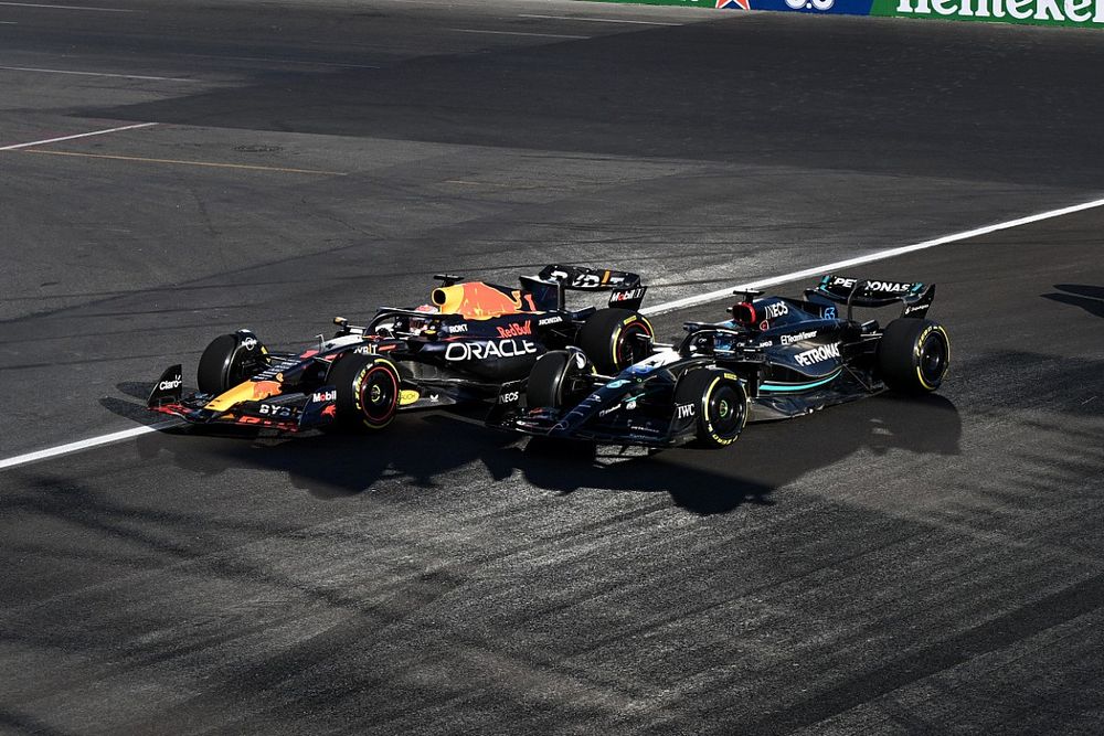 Max Verstappen, Red Bull Racing RB19, battles with George Russell, Mercedes F1 W14, ahead of Carlos Sainz, Ferrari SF-23