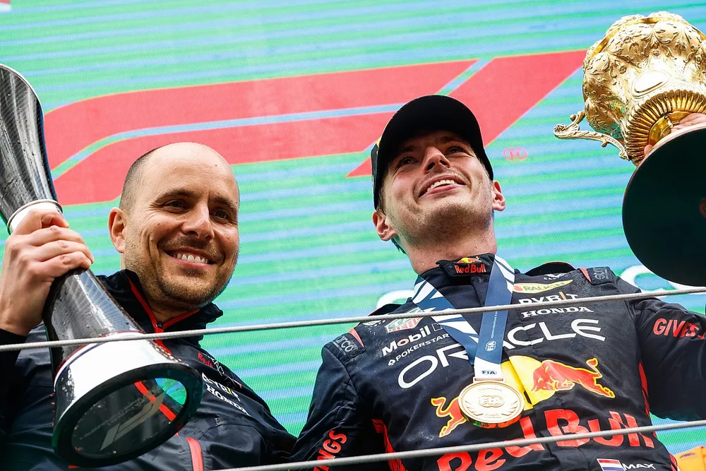 The Red Bull trophy delegate and Max Verstappen, Red Bull Racing, 1st position, on the podium with the trophies